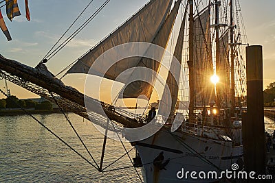 Unbeams come through the rigging and the sails of the tall sail ship GroÃŸherzogin Elisabeth Editorial Stock Photo